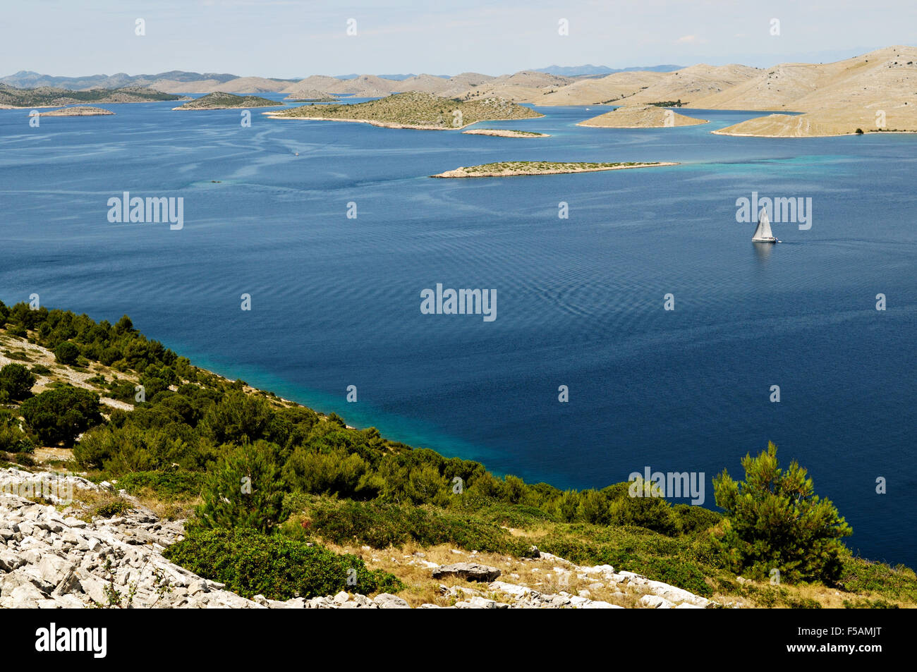 Sailboat in Kornati national park from the top of Levrnaka island, Dalmatia, Croatia Stock Photo