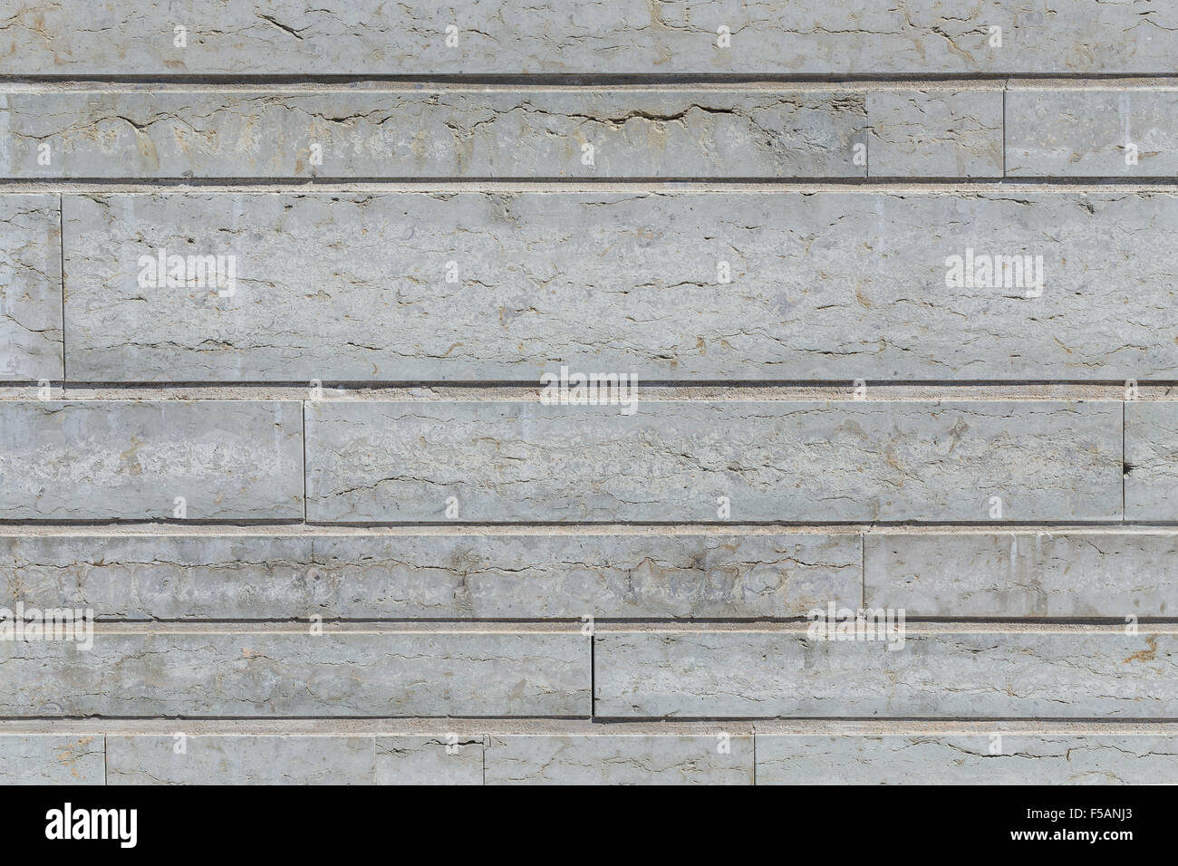 Gray stone wall closeup background photo texture Stock Photo - Alamy
