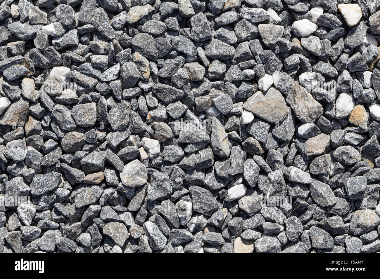 Crushed grey stone on the ground texture background Stock Photo - Alamy