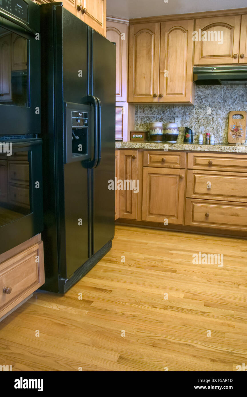 Kitchen With Oak Cabinets Wood Floor New Appliances And Granite