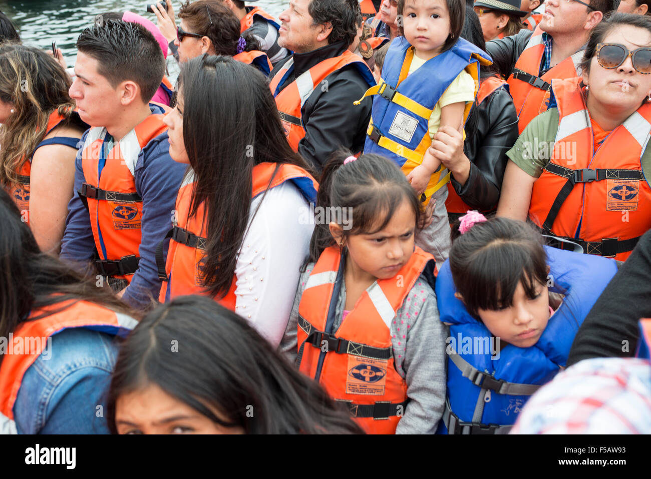 Tourists in life-vests on a boat, Valapraiso Stock Photo