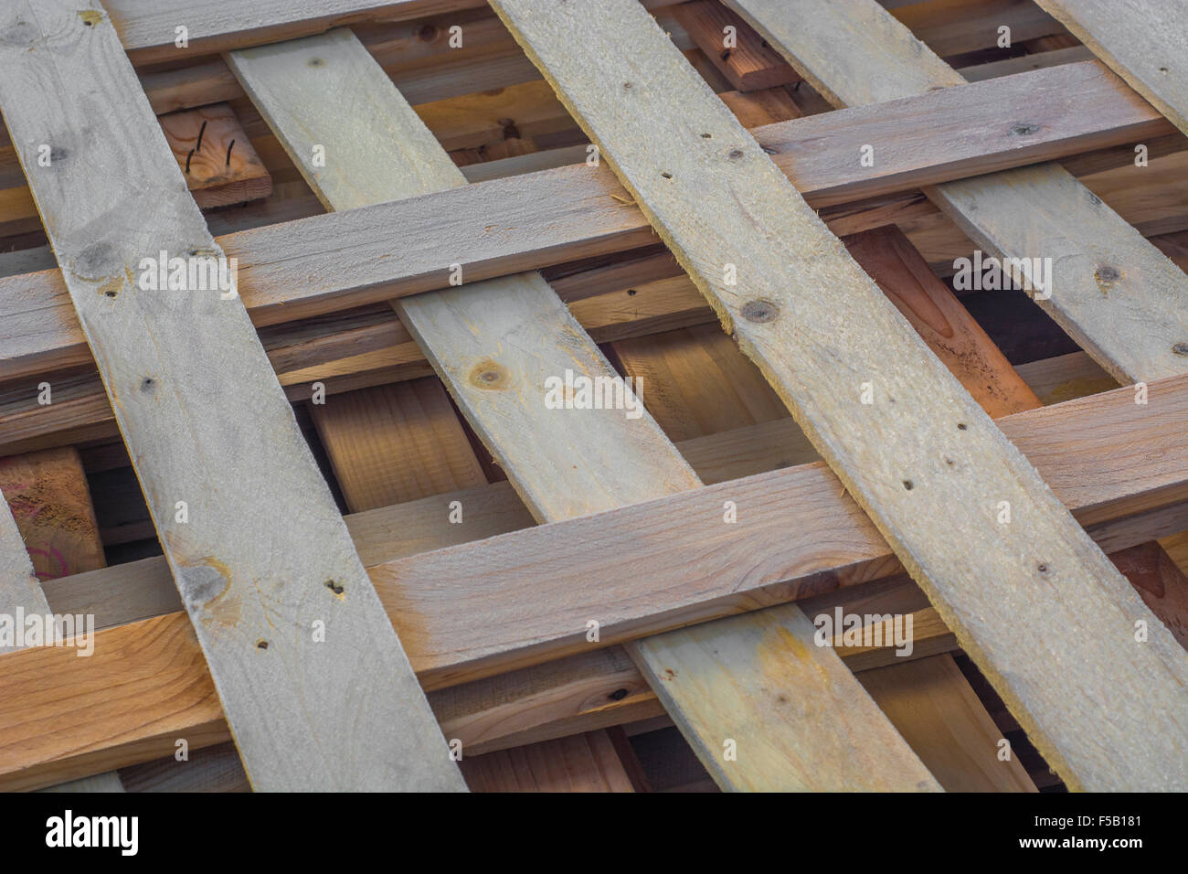Frost covered wooden pallets / planking awaiting recycling Stock Photo