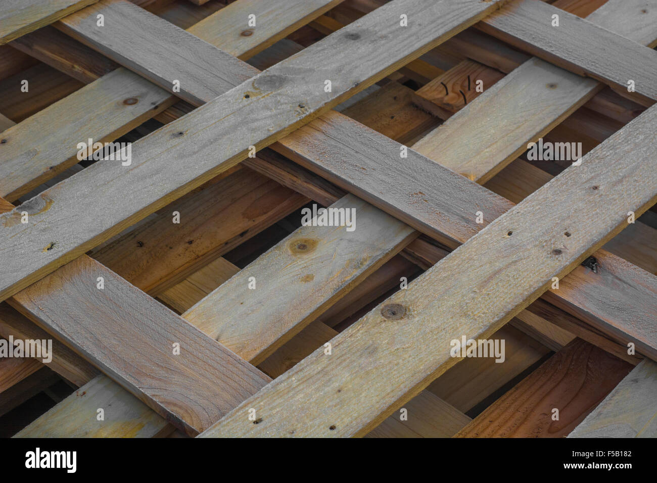 Frost covered wooden pallets / planking awaiting recycling Stock Photo