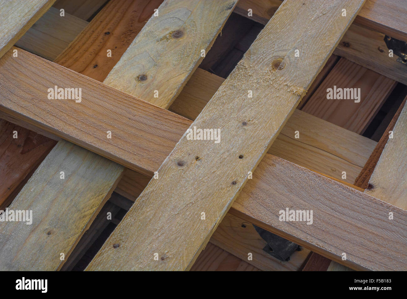 Frost covered wooden pallets / planking awaiting recycling Stock Photo