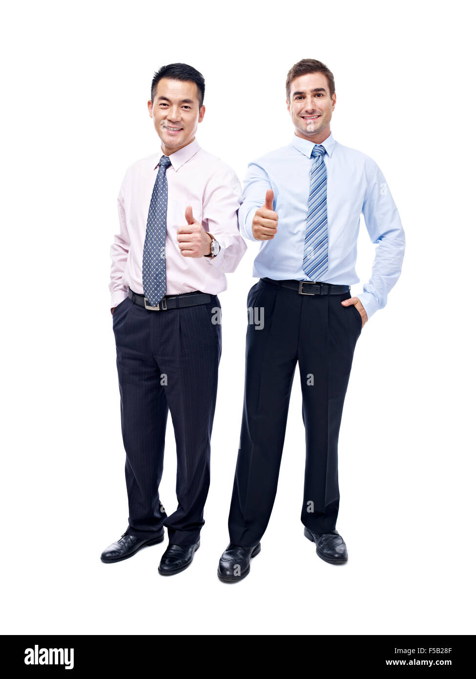 asian and caucasian business executives showing the thumb-up sign Stock Photo