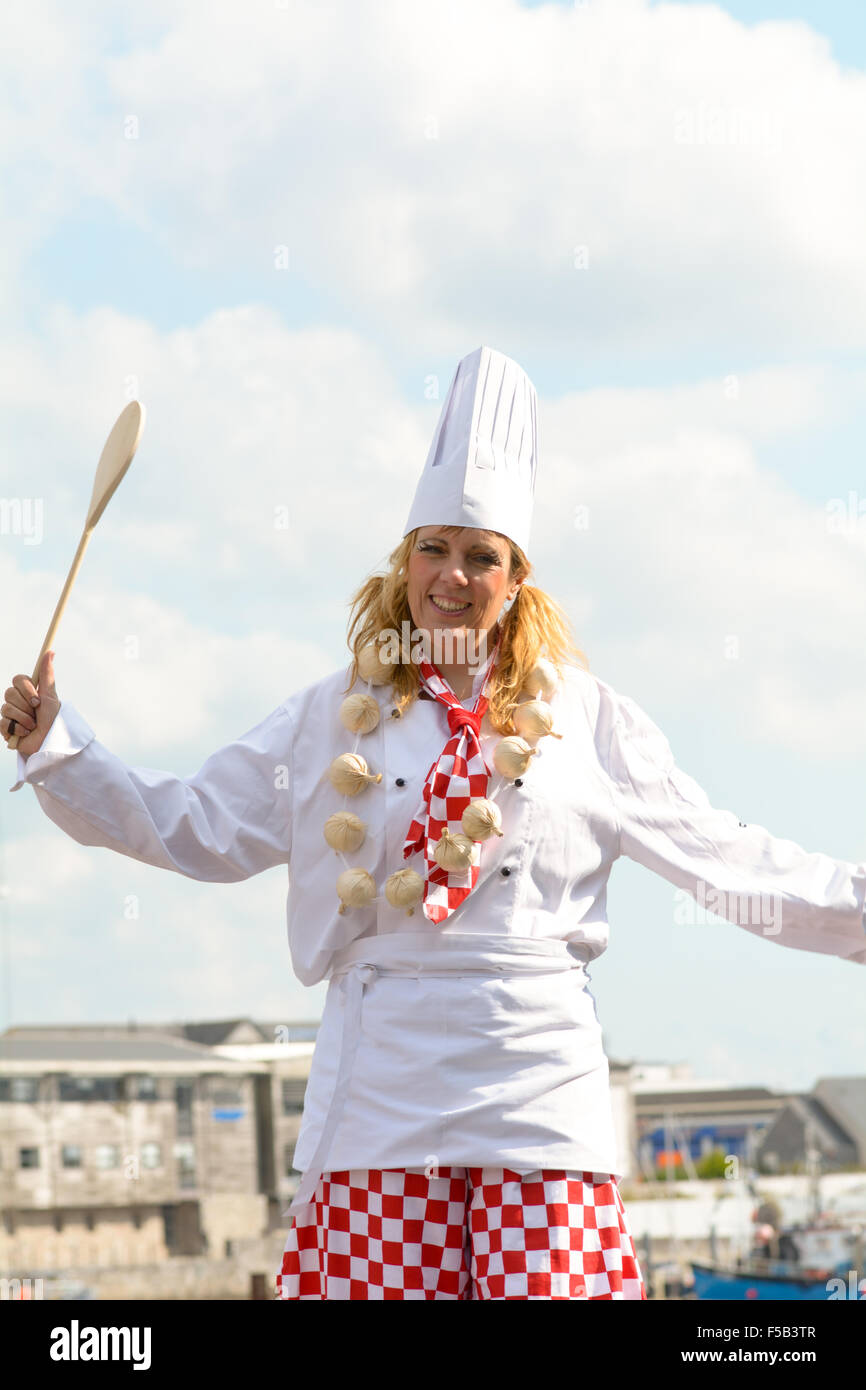 Stilt walker dressed as a chef in Sutton Harbour at Plymouth Food