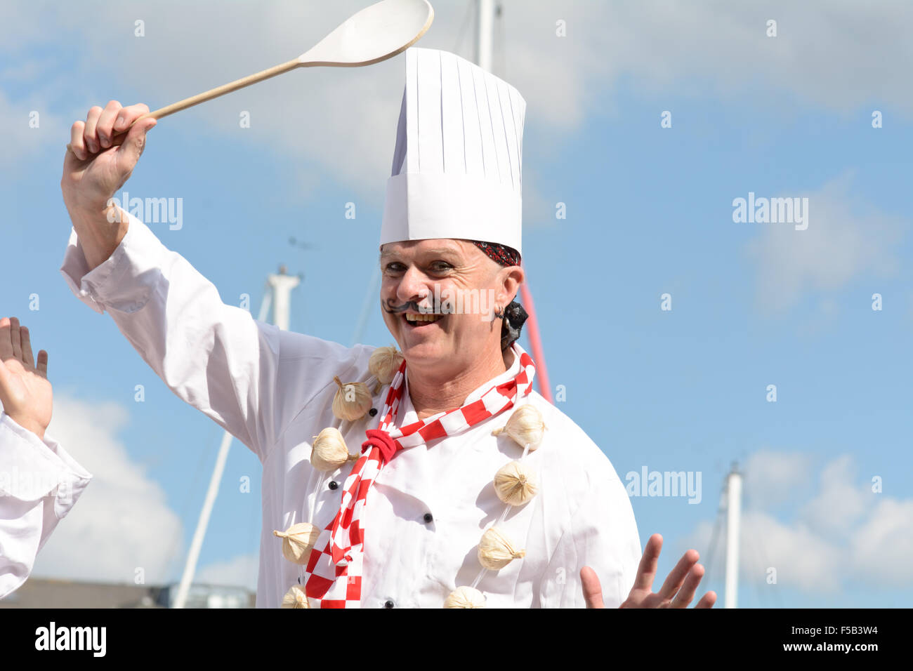 Stilt walker dressed as a chef in Sutton Harbour at Plymouth Food
