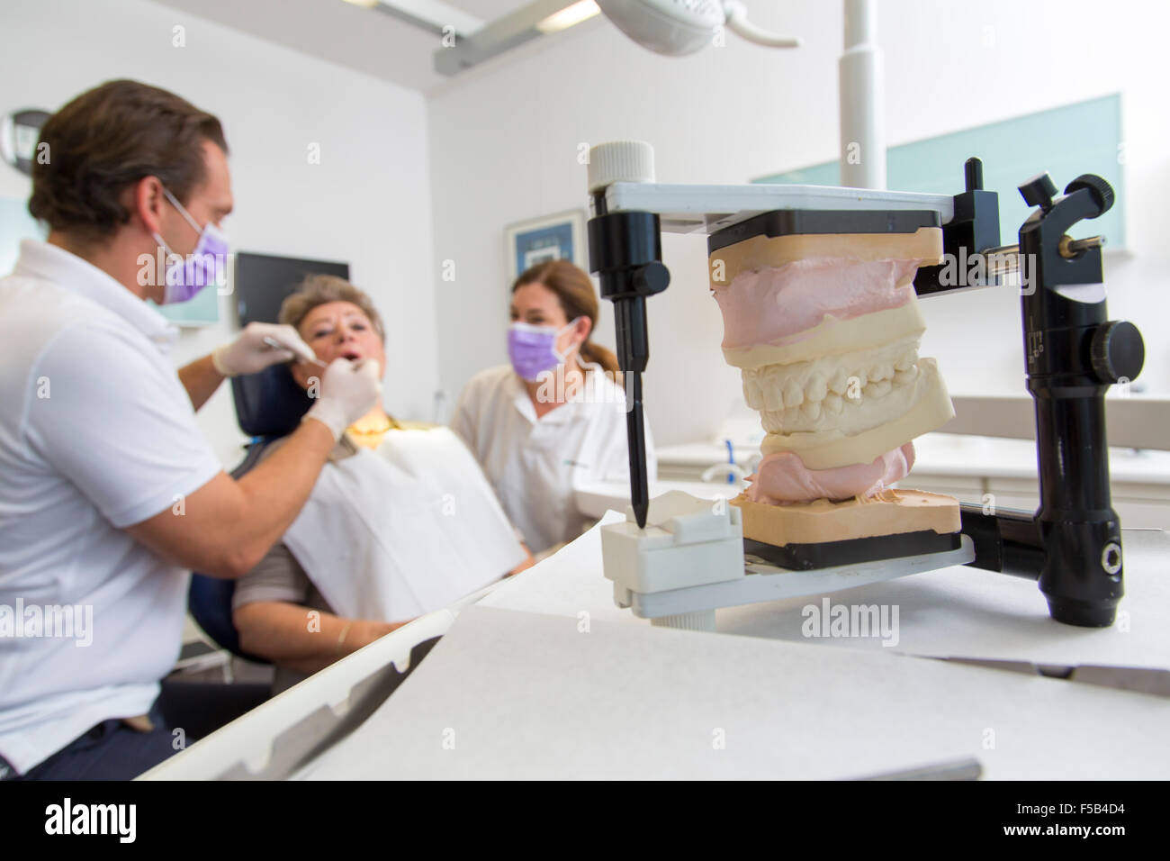 Dentist Office Dentist Assistant And Older Patient Dental Stock