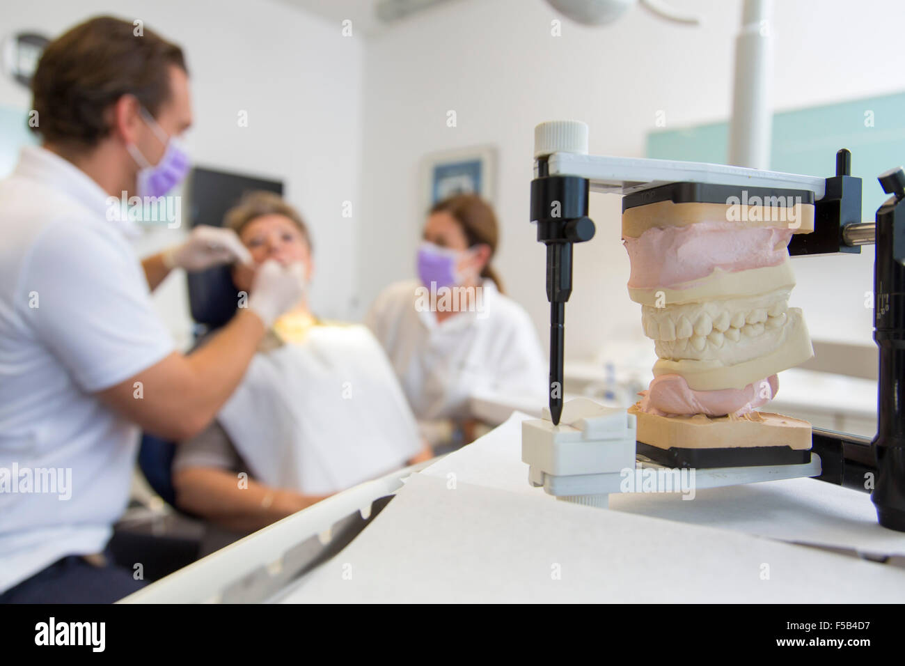 Dentist office, dentist, assistant and older patient, dental treatment