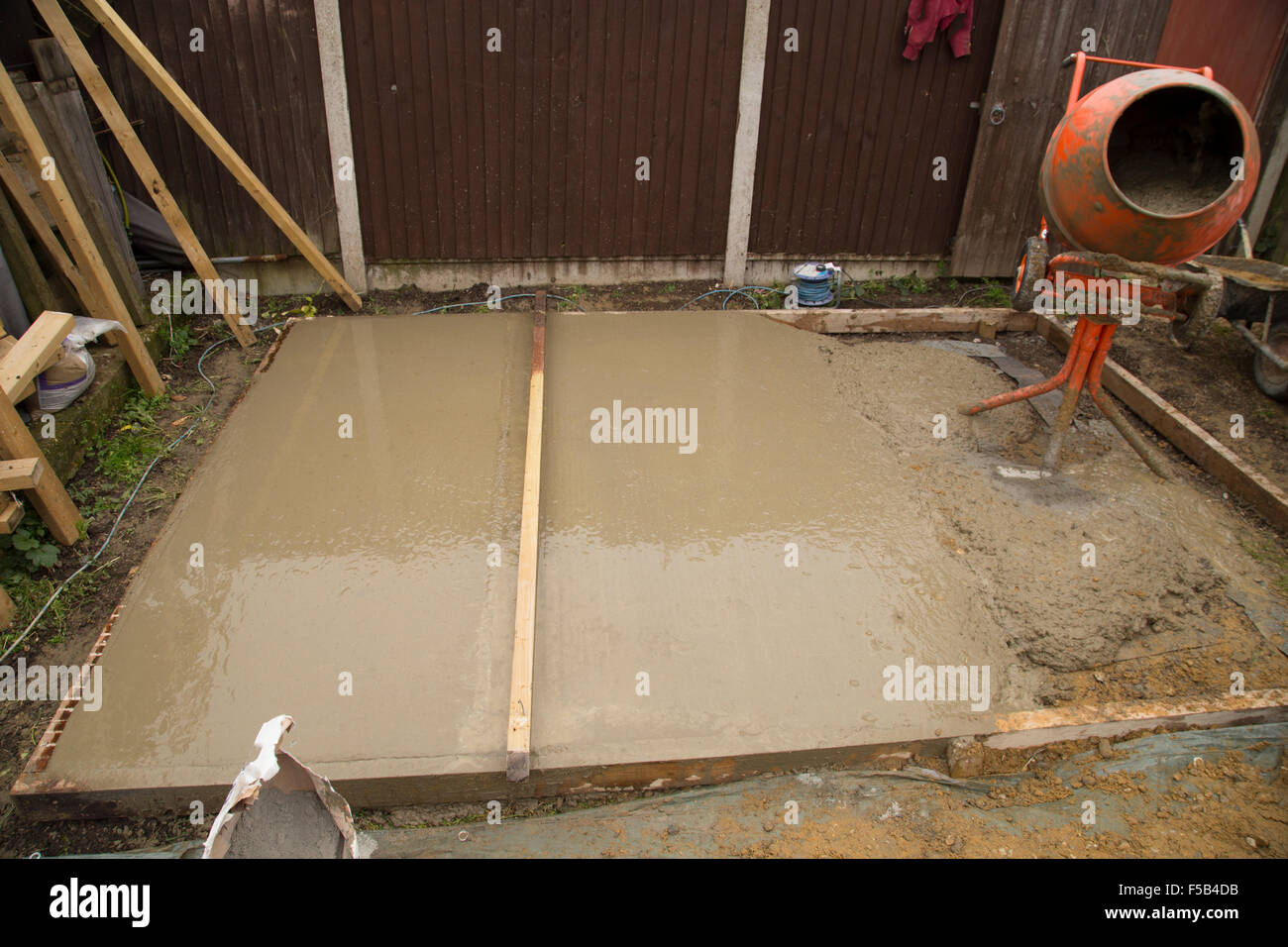 Smoothing of cement of a shed base Stock Photo