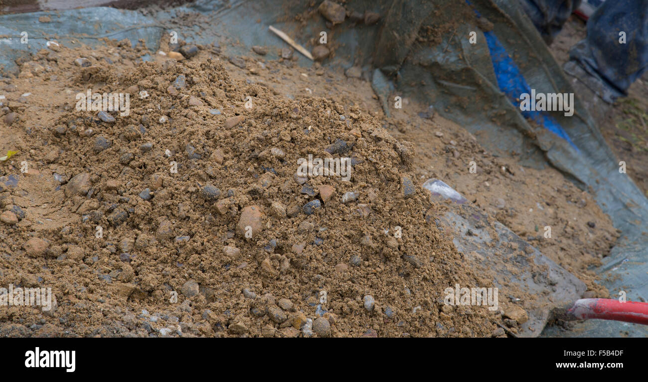 digging ballast and sand cement mix with a shovel Stock Photo Alamy