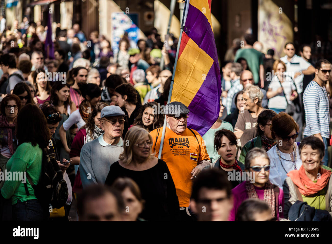 October 31st, 2015. Barcelona, Spain: Demonstrators make their way to Barcelona's town hall in support of refugees and protesting war and the NATO. Stock Photo