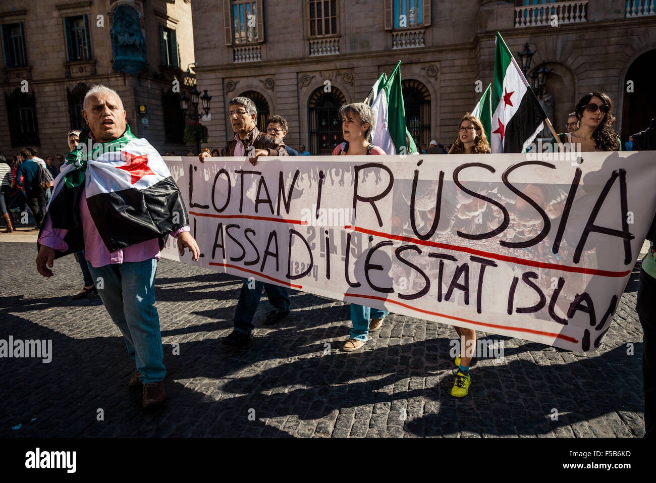 October 31st, 2015. Barcelona, Spain: Pro-palestine demonstrators protest behind their banner in Barcelona to against the NATO, Russia, Assad and the ISIS. Stock Photo