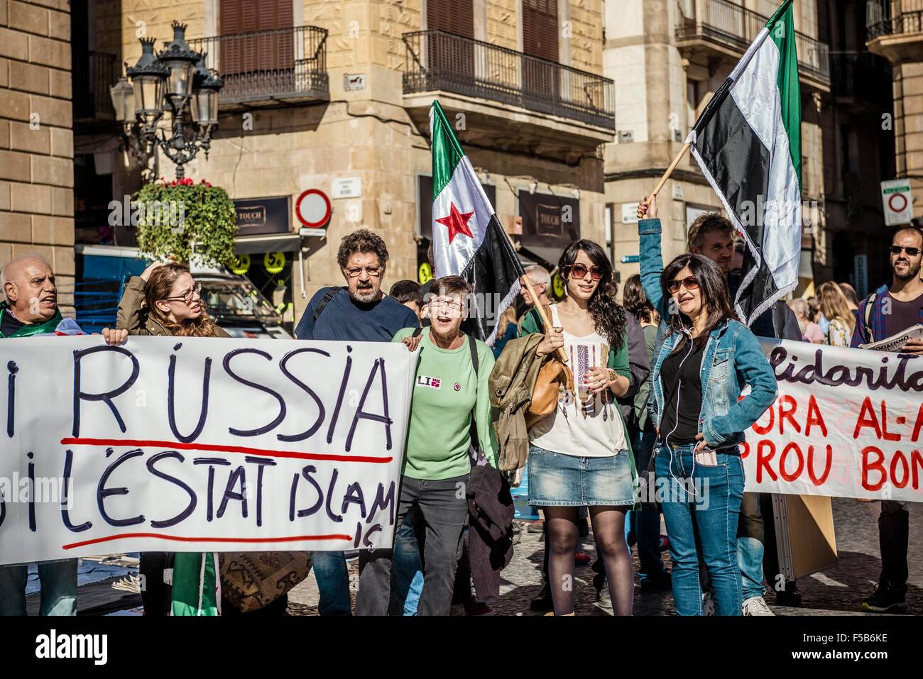 October 31st, 2015. Barcelona, Spain: Pro-palestine demonstrators protest behind their banner in Barcelona to against the NATO, Russia, Assad and the ISIS. Stock Photo