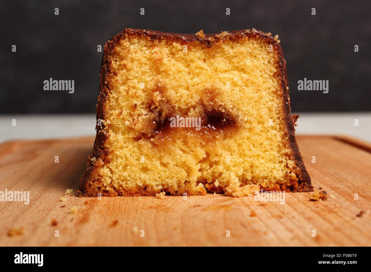 Chocolate glazed loaf cake with strawberry jam Stock Photo Alamy