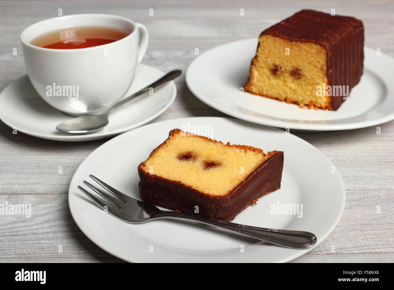 Chocolate glazed loaf cake with strawberry jam Stock Photo Alamy