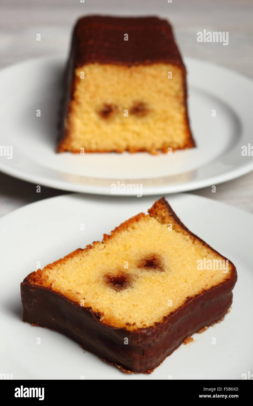 Chocolate glazed loaf cake with strawberry jam Stock Photo Alamy