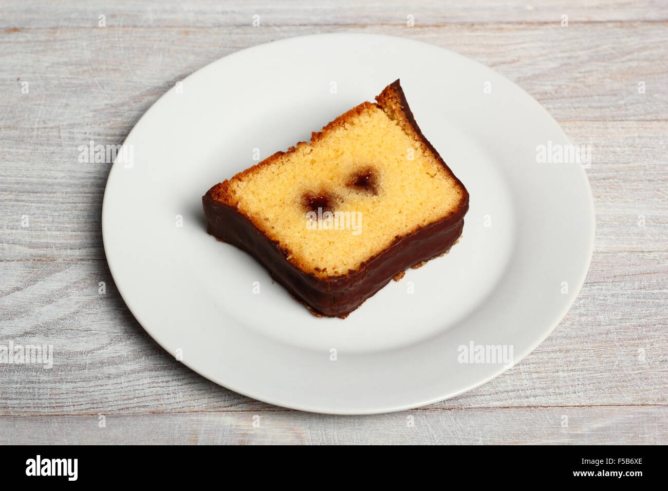 Chocolate glazed loaf cake with strawberry jam Stock Photo Alamy
