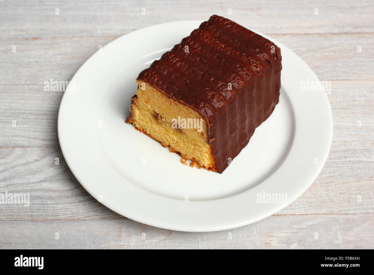 Chocolate glazed loaf cake with strawberry jam Stock Photo Alamy