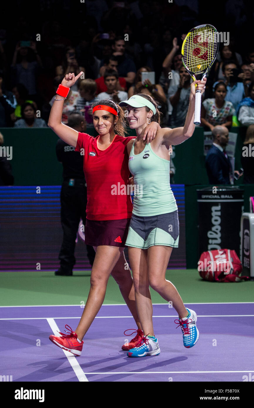 Martina Hingis / Sania Mirza celebrate after winning the double final of BNP Paribas WTA Finals Singapore 2015 at Singapore Indoor Stadium, Singapore, 1 Nov 2015 Stock Photo