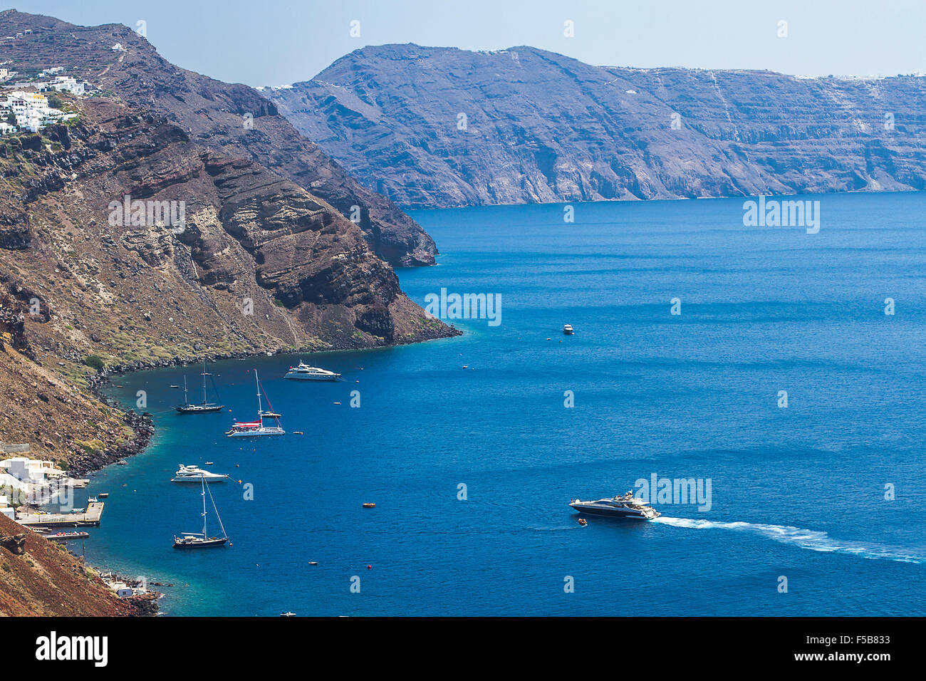 Santorini bay with many yacht in Greece, top view Stock Photo