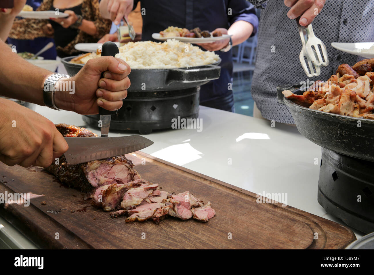 preparing Roast Beef at a buffet table Stock Photo Alamy