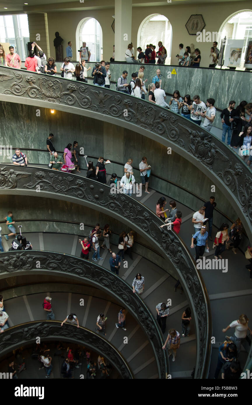 VATICAN CITY, VATICAN STATE - SEPTEMBER 27, 2015: People descend the modern double helix staircase designed by Giuseppe Momo Stock Photo