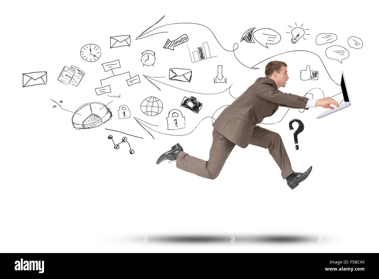 Man in suit running with laptop Stock Photo - Alamy