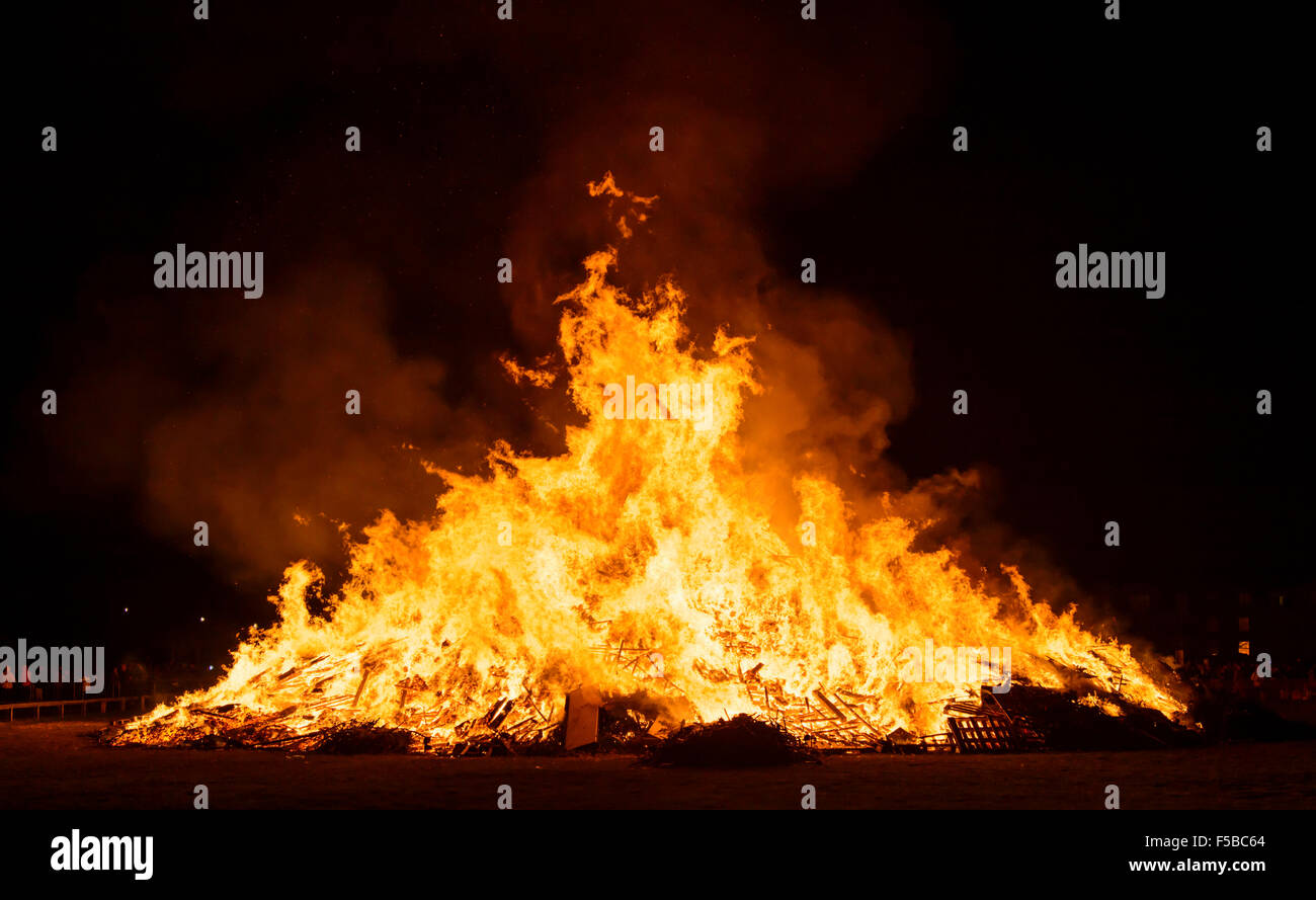 Bonfire burning in celebration of Guy Fawkes night in the UK. Stock Photo