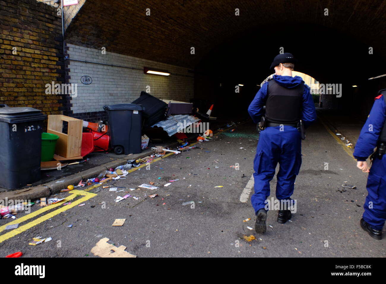 Police look at Debris from the rioting ravers Stock Photo