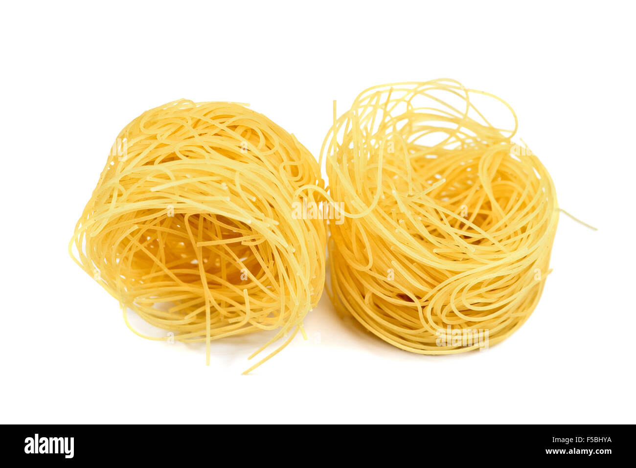 Nest pasta. View from side. Isolated on white Stock Photo