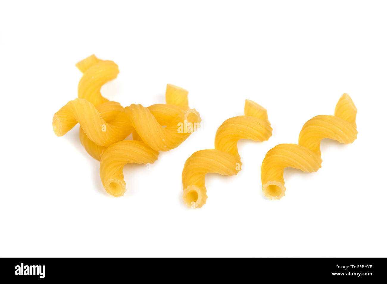 Cellentani pasta macro on white background Stock Photo