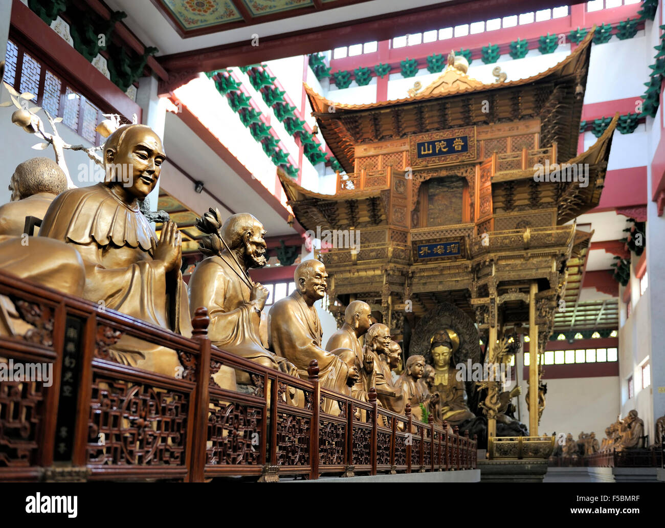 Hall with statues at Lingyin Temple, Hangzhou, Shandong Province, China Focused at left statue Stock Photo