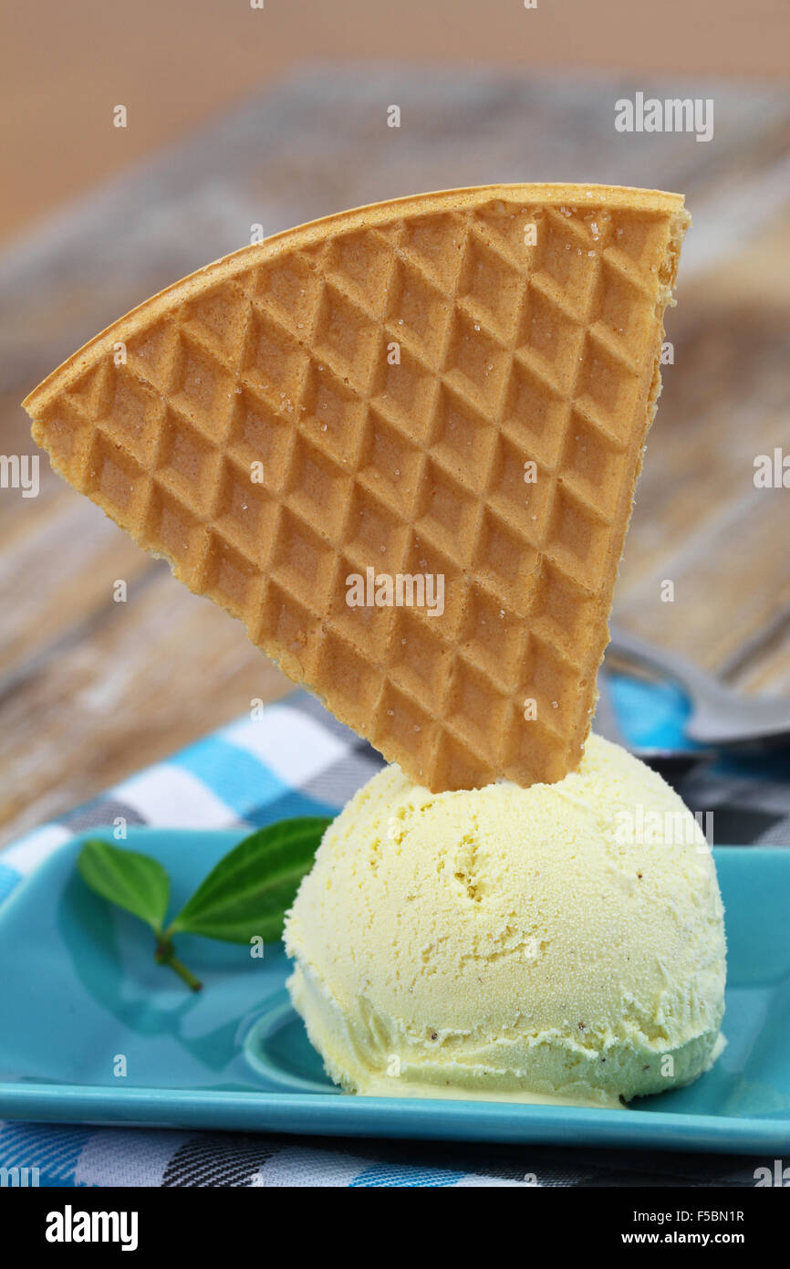 Scoop of vanilla ice cream with sweet wafer Stock Photo