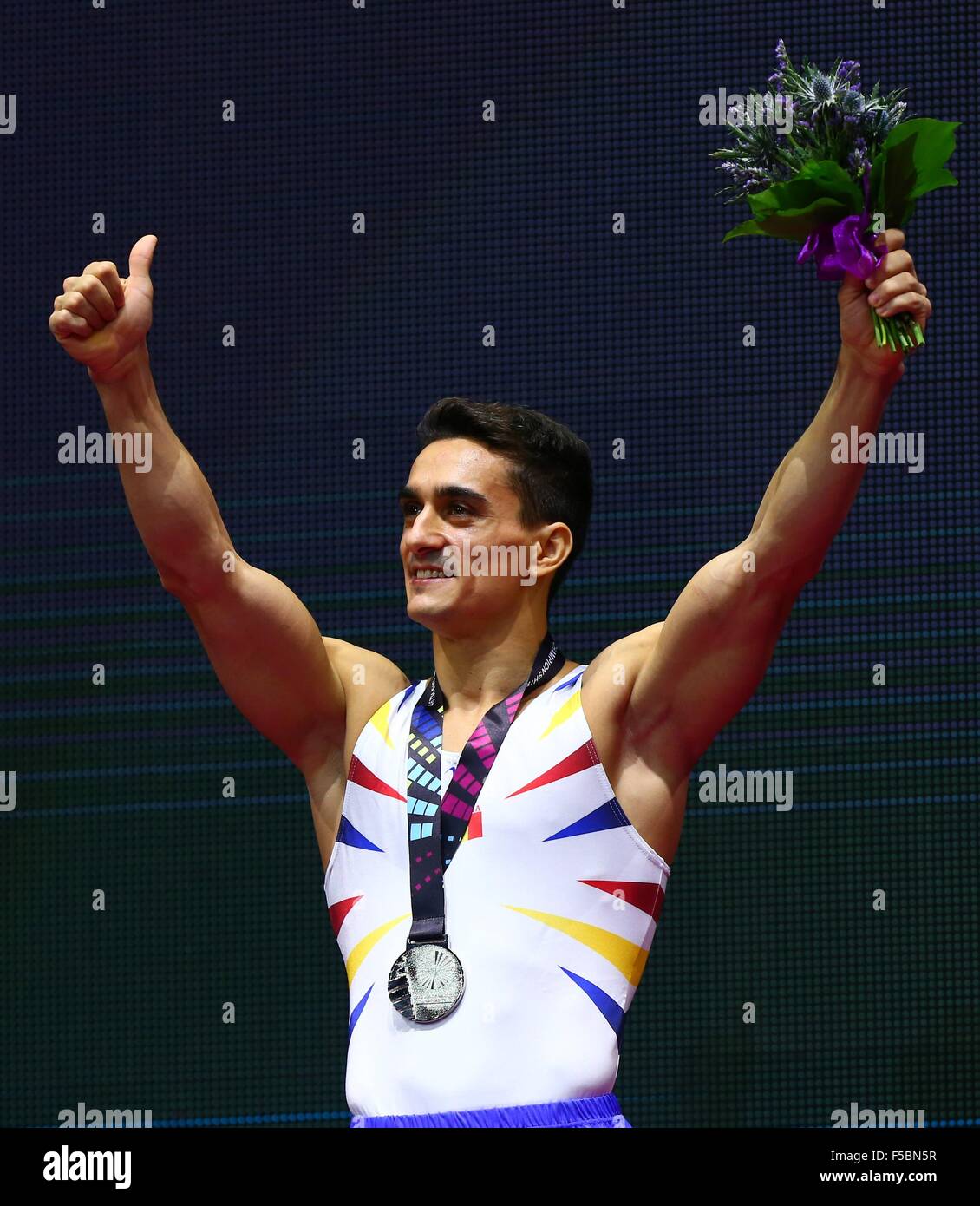 Glasgow, Great Britain. 1st Nov, 2015. Marian Dragulescu from Romania reacts on the podium after the men's Vault Final at the 46th World Artistic Gymnastics Championships at the SSE Hydro Arena in Glasgow, Scotland, Great Britain, on Nov. 1, 2015. Dragulescu won the silver medal. © Gong Bing/Xinhua/Alamy Live News Stock Photo