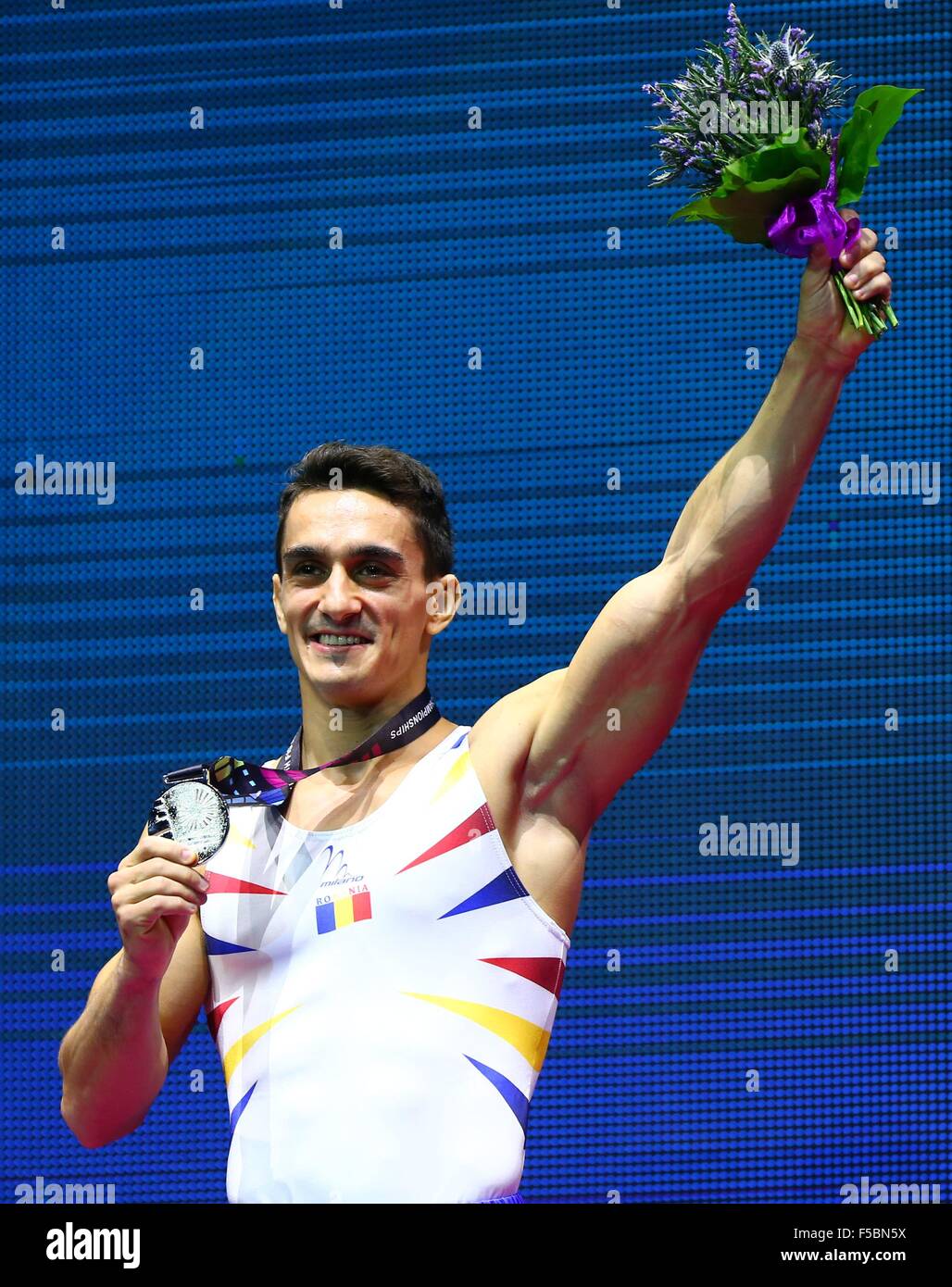 Glasgow, Great Britain. 1st Nov, 2015. Marian Dragulescu from Romania reacts on the podium after the men's Vault Final at the 46th World Artistic Gymnastics Championships at the SSE Hydro Arena in Glasgow, Scotland, Great Britain, on Nov. 1, 2015. Dragulescu won the silver medal. © Gong Bing/Xinhua/Alamy Live News Stock Photo