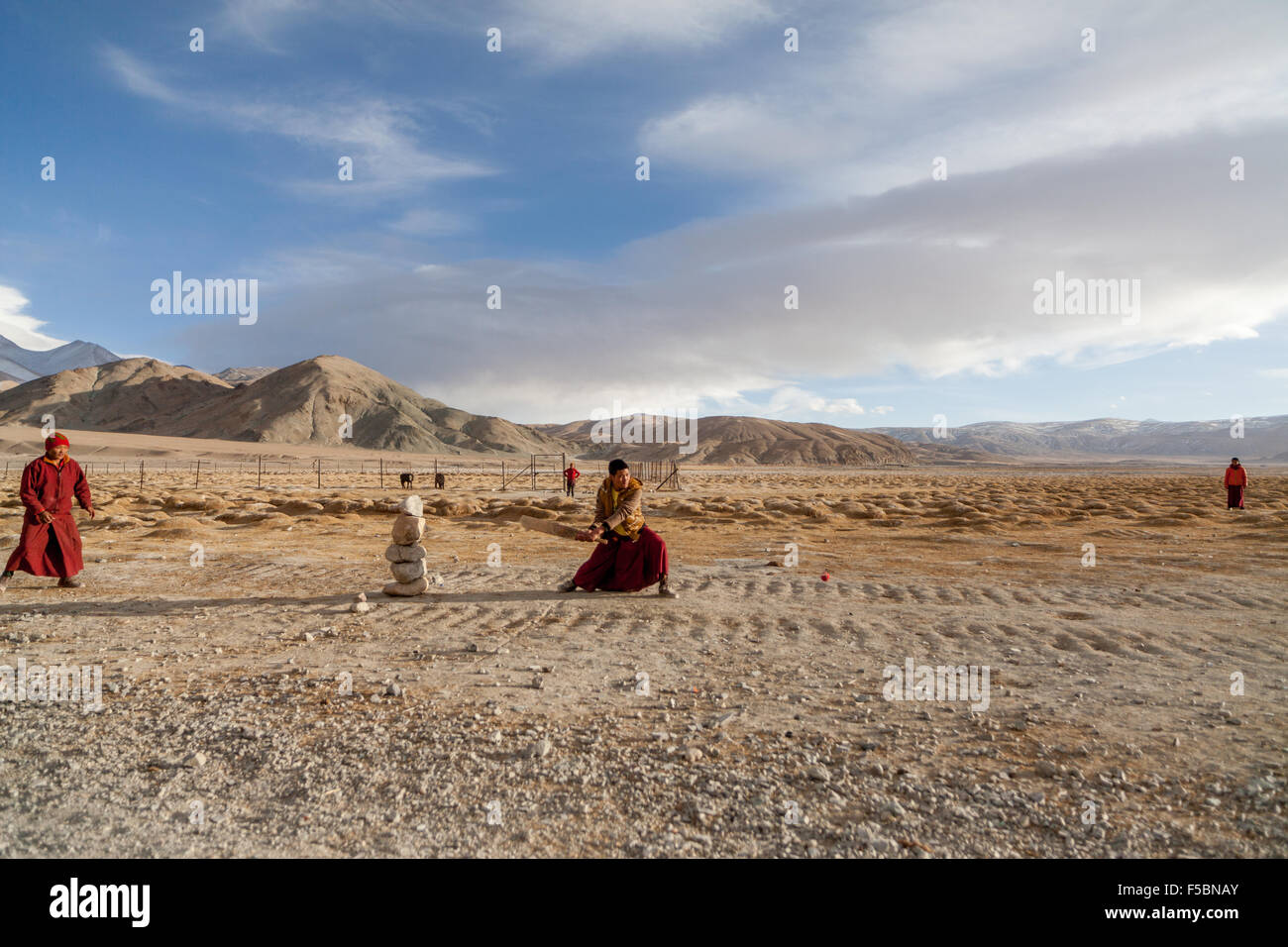 The monks from the Hanle monastery playing a friendly game of cricket in the cold Ladakhi winter. Stock Photo