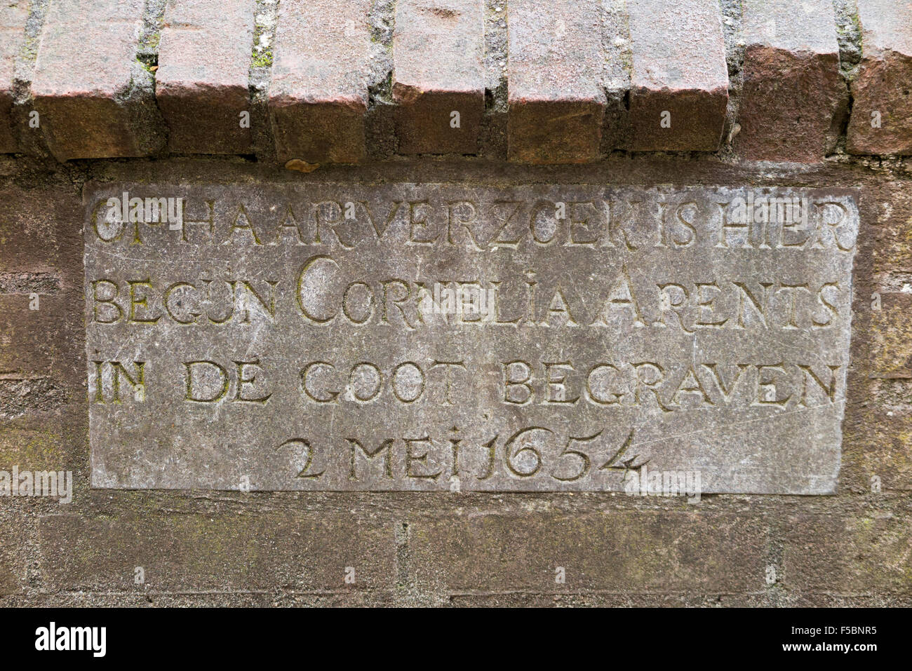 Gutter grave stone of Cornelia Arens, a devout inhabitant  – a beguine – of the Begijnhof of Amsterdam. Holland. The Netherlands Stock Photo