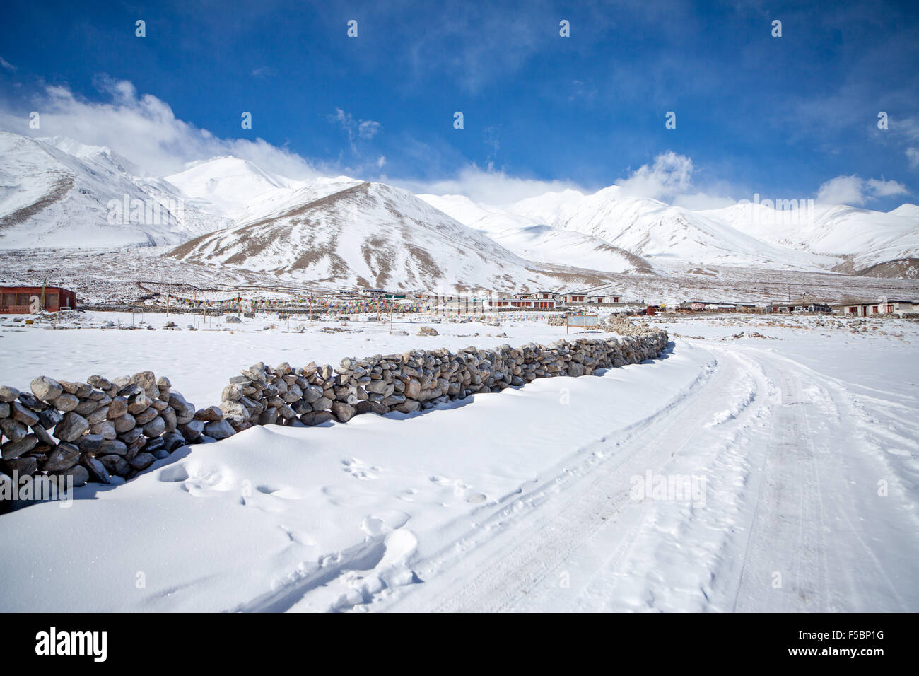 The snow covered road along the shore of the Pangong lake Stock Photo