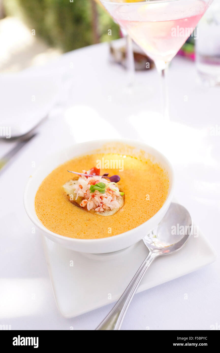 Latitudes Restaurant on Sunset Key, Key West, Florida, USA - Lobster bisque soup for Lunch with vodka Cosmopolitan cocktail Stock Photo