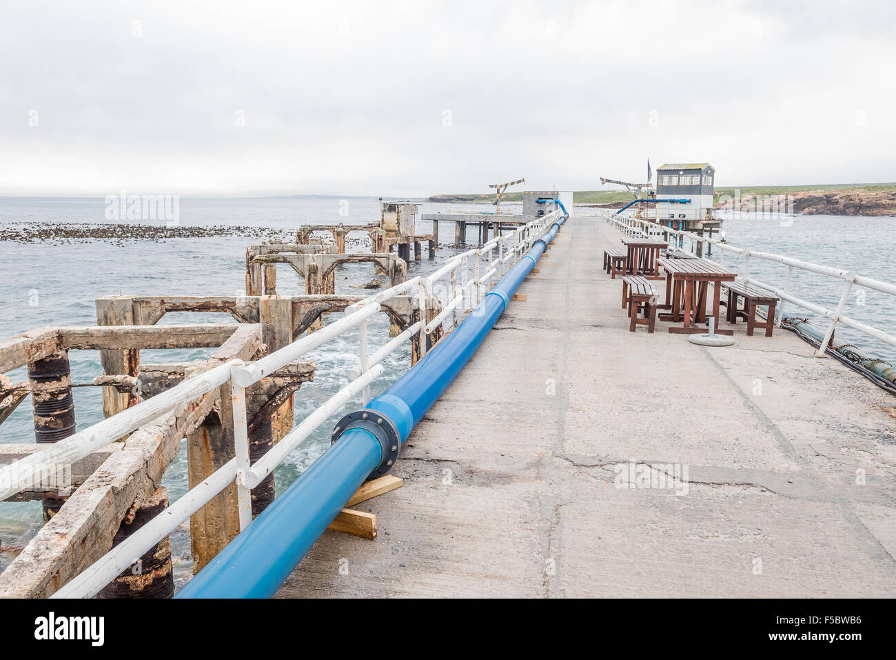DOORNBAAI, SOUTH AFRICA, AUGUST 12, 2015: The old and new piers at the harbor at Doornbaai (Thorn Bay) on the Atlantic coast of Stock Photo