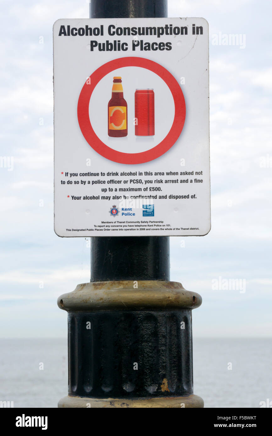 A notice under a Designated Public Places Order warns against drinking in public. Stock Photo