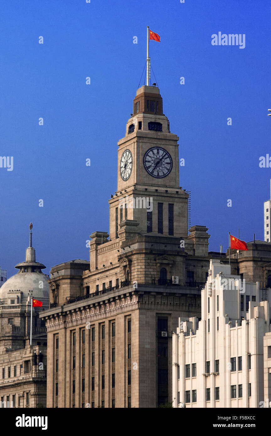 The Bund lit up at night with Customs House and HSBC buildings Bund Shanghai. Bell Tower of the Shanghai Customs House, The Bund Stock Photo