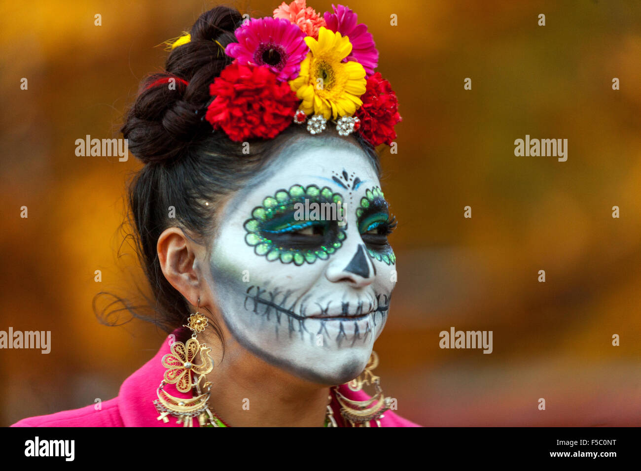 Woman in makeup for Day of the Dead mask Stock Photo