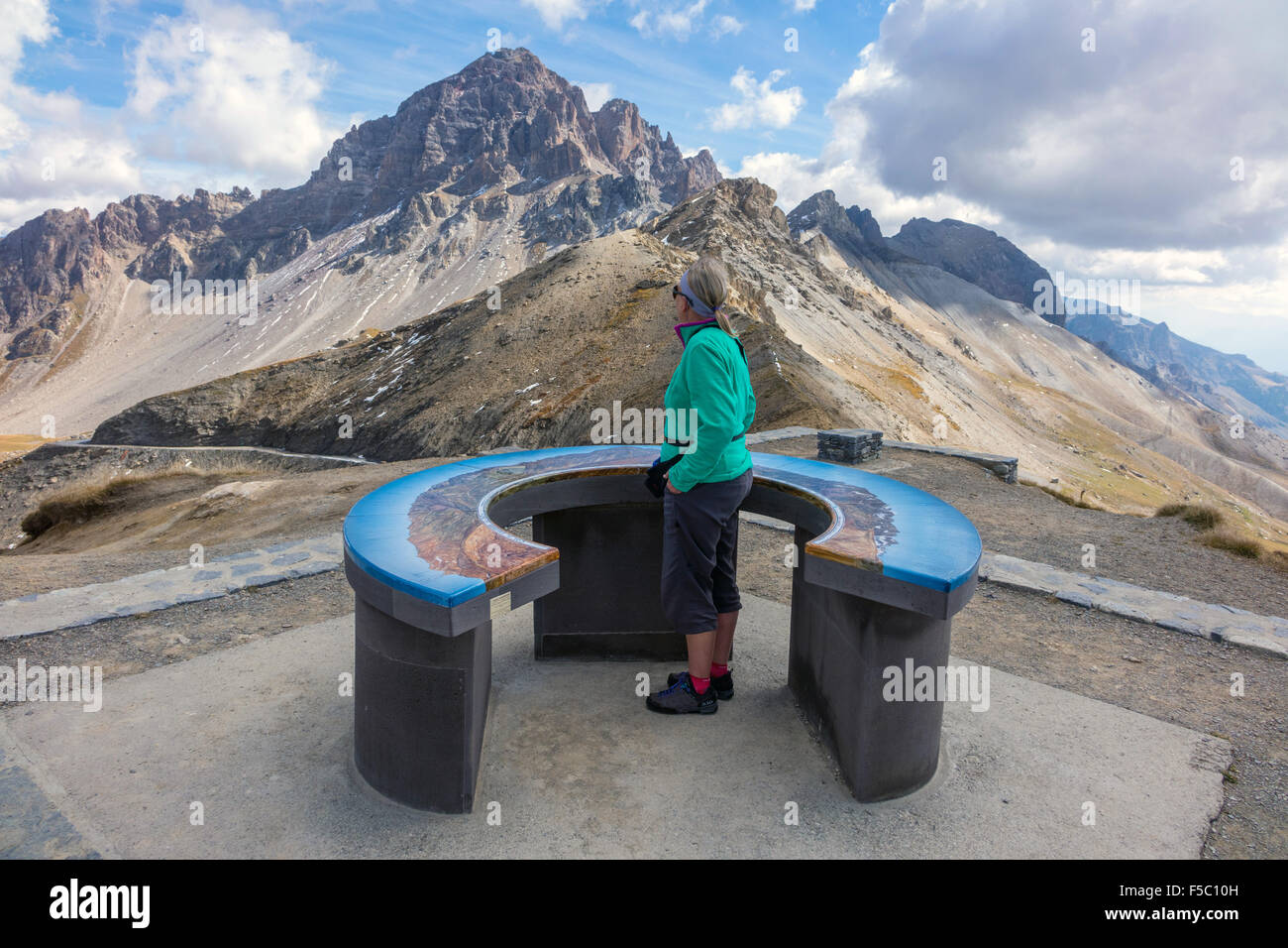 Female figure at viewpoint, table d'orientation, Col de Galibiere, France Stock Photo