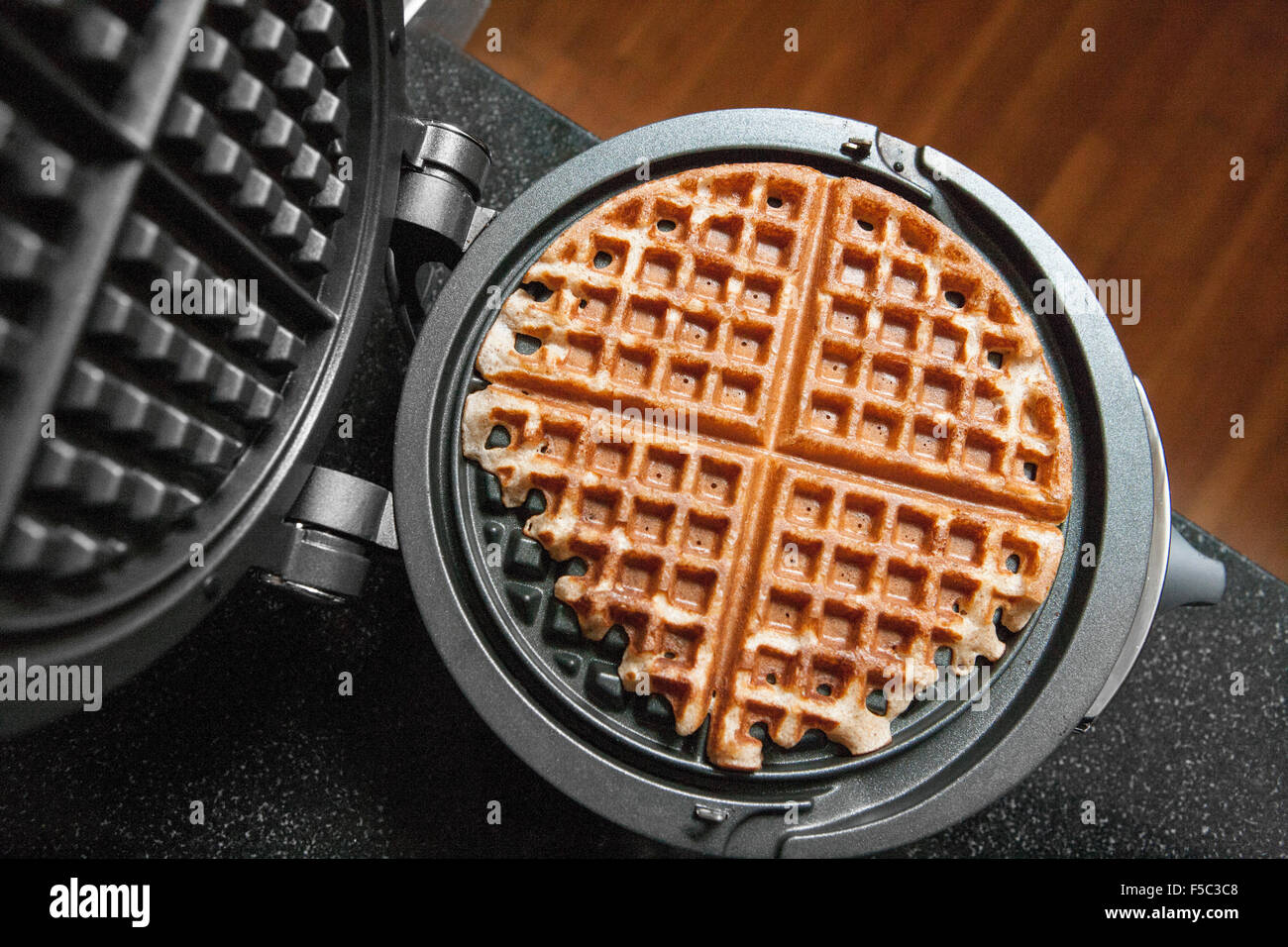 Waffle and Waffle Iron Stock Photo