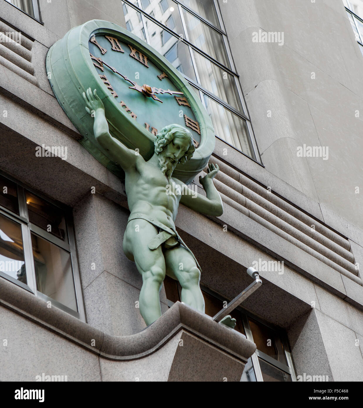 Statue of Man Holding Clock on Shoulders, Tiffany Building, New York City, USA Stock Photo