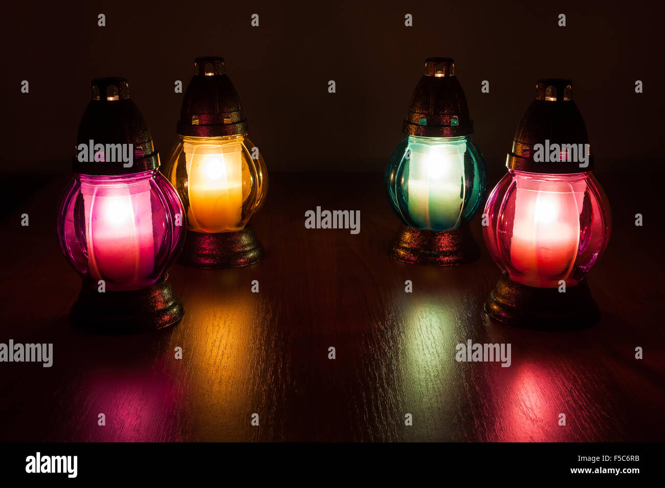 Closeup of burning votive candles in the dark Stock Photo Alamy
