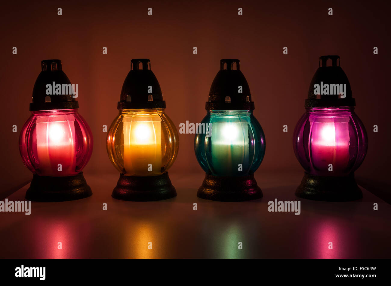 Closeup of burning votive candles in the dark Stock Photo Alamy