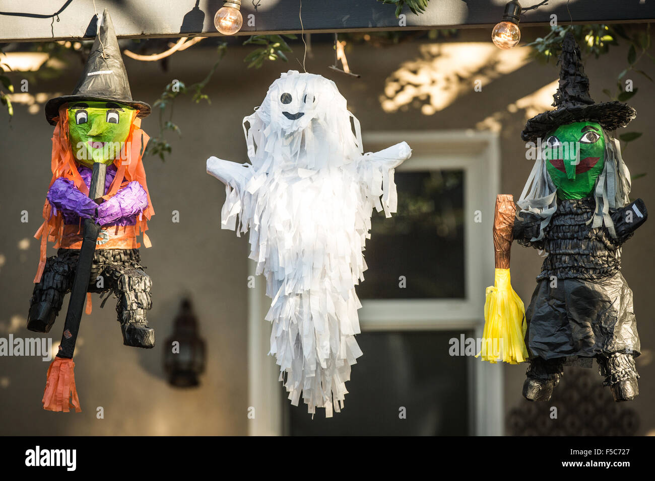 Halloween pinatas from Mexico hanging outside a home in California at Halloween. Stock Photo